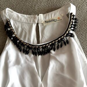 White beaded fit and flare dress. Size medium. Not see-through. Flowy and cute